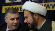 Former Iraq Minister of Communications Mohammed Allawi, (L), and Imam Hersham Al Huseini, co-founder of the Iraqi opposition movement against Saddam Hussein, pariticipate in a discussion billed as 