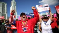 Fermin Vazquez cheers before the arrival of Republican presidential candidate Donald Trump during his campaign rally at the Bayfront Park Amphitheater on November 2, 2016 in Miami, Florida. Trump continues to campaign against his Democratic challenger Hil