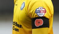 General view of a poppy on a black armband for remembrance day. (Reuters / Ed Sykes)