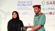 Fatima Haidar, Chief Human Resources Officer at HMC, receiving the award.