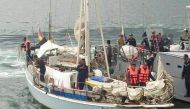 Philippine navy personnel stand onboard the yatch Rockall, where the body of a naked white woman who had been shot was found aboard, after it was in Sulu province (AFP Photo).