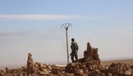 A member of the Syrian Democratic Forces (SDF), a US-backed Kurdish-Arab alliance, patrols in the village of Tal Aaj, 5 kilometre from the Syrian town of Ain Issa, some 50 kilometres (30 miles) north of Raqa, on November 7, 2016, as they launched an offen