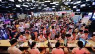 A file photo of people waiting for tickets at a movie theater in Wuhan, China. Reuters 