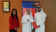 Abdullah Al Jaidah (right) ACCA Member honouring Yousef Al-Naama at the event, as Fazeela Gopalani, ACCA Head of Education looks on.