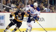 Edmonton Oilers center Connor McDavid (97) controls the puck against Pittsburgh Penguins center Sidney Crosby (87) during the first period at the PPG Paints Arena. Charles LeClaire-USA TODAY Sports