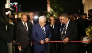 Ahmed Aboul Gheit, Secretary-General of the Arab League (L), Palestinian president Mahmud Abbas (C) and former Secretary-General of the Arab League Amr Mousa cut the ribbon during the inauguration ceremony of late Palestinian leader Yasser Arafat's Museum