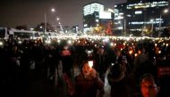 People march toward the Presidential Blue House during a rally demanding President Park Geun-hye to step down in central Seoul, South Korea, November 12, 2016. REUTERS/Kim Hong-Ji
