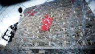 The Ankara police headquarters is seen through a cars' broken window caused by fighting during a coup attempt in Ankara, Turkey, July 19, 2016. (REUTERS / Baz Ratner) 