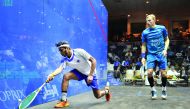 Abdulla Mohd Al Tamimi of Qatar (left) in action against Nick Matthew of England in Qatar Classic squash championship in Doha yesterday. Pics by: Abdul Basit/The Peninsula
