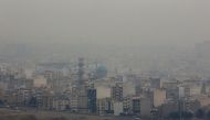 Exhaust fumes from millions of cars and motorcycles that ply Tehran's roads account for 80 percent of its pollution, which increases in winter as emissions fail to rise above cold air (AFP Photo/Atta Kenare)