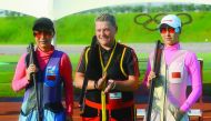 Katrin Quooss (centre) of Germany, gold medal winner in the Shotgun Trap event at the 49th CISM World Military Shooting Championship poses for a picture along with Wand Jinglin of China and Wand Yajun of China, bronze and silver medal winners.