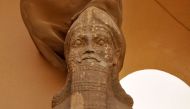 (FILES) This file photo taken on April 09, 2013 shows a partial view of an ancient statue dated from the Assyrian civilization, at the archaeological site of Nimrud that lies on the Tigris River around 30 kilometres (18 miles) southeast of Mosul, Iraq's s