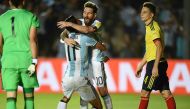 Argentina's Angel Di Maria celebrates with Argentina's Lionel Messi after scoring against Colombia during their 2018 FIFA World Cup qualifier football match in San Juan, Argentina, on November 15, 2016. / AFP / EITAN ABRAMOVICH