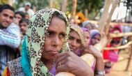 Indian villagers queue outside a bank as they wait to deposit and exchange 500 and 1000 rupee notes in Hanuman Ganj village on the outskirts of Allahabad on November 18, 2016. India's government asked its citizens to put up with what it called the 