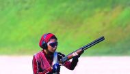 A Qatari shooter in action during the  Women's Skeet team event.