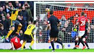 Arsenal's French striker Olivier Giroud (L) scores his team's first goal during the English Premier League football match between Manchester United and Arsenal at Old Trafford in Manchester, north west England, on November 19, 2016. AFP / Paul ELLIS