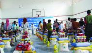 People receiving aid at a distribution point set up by RAF in Taiz, a besieged city of Yemen.