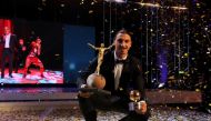 Zlatan Ibrahimovic of Manchester United is seen with his statue on the stage as he wins Sweden's Golden Ball award for the country's best player for the 10th year in a row in Stockholm, Sweden on November 21, 2016. Atila Altunta? - Anadolu Agency 
