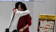 Utinan Won bids goodbye to his mother Lonsan Phaphakdee at Narita International Airport, before she returns to Thailand, in Chiba, Japan, September 15, 2016. (REUTERS/Thomas Wilson)