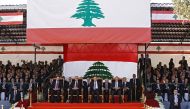 Lebanese President Michel Aoun (C), Parliament Speaker Nabih Berri (C2-L), Caretaker Prime Minister Tamam Salam (C-R) and new Prime Minister Saad Hariri (C3-L) sit during an official ceremony commemorating the country's 73rd independence day in the capita