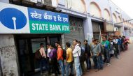 People queue outside an ATM of State Bank of India (SBI) to withdraw money in Kolkata, India, November 22, 2016. REUTERS/Rupak De Chowdhuri