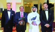 Managing Director of Lulu Group, Yusuffali M A (second left) and  Secretary-General of Supreme Committee for Delivery and Legacy, Hassan Al Thawadi (third left), after receiving the SDCL Award from the Ambassador of Spain to Qatar, Ignacio Escobar (left) 