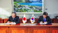 This handout photo taken on November 23, 2016 and released by South Korea's Defence Ministry shows South Korean Defence Minister Han Min-Koo (R) and Japanese Ambassador to Seoul Yasumasa Nagamine (L) during a signing ceremony of the General Security of Mi