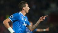 Juventus' Croatian forward Mario Mandzukic celebrates after scoring during the UEFA Champions League football match Sevilla FC vs Juventus at the Ramon Sanchez Pizjuan stadium in Sevilla on November 22, 2016. / AFP / JORGE GUERRERO
