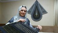 Painter and decorative artist Tünzale Memmedzade wrote Quranic verses on silk. Nov. 2016. (AA Photo)