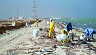Trash being removed from a beach in Qatar. 