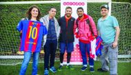 The winners with sporting hero and Ooredoo brand ambassador Leo Messi in Barcelona.