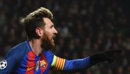 Barcelona's Argentinian striker Lionel Messi celebrates scoring the opening goal during the UEFA Champions League group C football match between Celtic and Barcelona at Celtic Park in Glasgow on November 23, 2016. / AFP / Paul ELLIS
