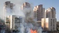 A picture taken on November 24, 2016 shows a fire raging in the northern Israeli port city of Haifa. Hundreds of Israelis fled their homes on the outskirts of the country's third city Haifa with others trapped inside as firefighters struggled to control r