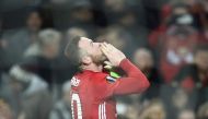 Manchester United's English striker Wayne Rooney celebrates scoring the opening goal during the UEFA Europa League group A football match between Manchester United and Feyenoord at Old Trafford stadium in Manchester, north-west England, on November 24, 20