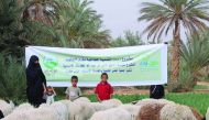 A widow and her children with sheep provided by RAF for breeding under income generation project implemented in Morocco.