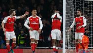 Arsenal's Nigerian striker Alex Iwobi (2R) reacts after deflecting the ball from Paris Saint-Germain's Brazilian midfielder Lucas Moura's header for Paris's second goal during the UEFA Champions League group A football match between Arsenal and Paris Sain