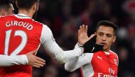Arsenal's Chilean striker Alexis Sanchez (R) celebrates with teammates after scoring their third goal during the English Premier League football match between Arsenal and Bournemouth at the Emirates Stadium in London on November 27, 2016.   AFP / Ben STAN
