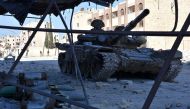 A tank is seen on a street on November 27, 2016 in the Masaken Hanano district in eastern Aleppo, a day after Syrian pro-government forces resized it from rebel fighters. AFP / GEORGE OURFALIAN