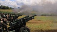 Philippine troops fire their 105mm howitzer cannons towards enemy positions from their base near Butig town in Lanao del Sur province on the southern island of Mindanao on November 27, 2016.  AFP / RICHEL UMEL
