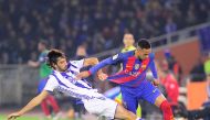 Real Sociedad's defender Carlos Martinez (L) vies with Barcelona's Brazilian forward Neymar da Silva Santos Junior during the Spanish league football match Real Sociedad vs FC Barcelona at the Anoeta stadium in San Sebastian, on November 27, 2016. / AFP /