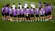 Real Madrid's players observe a minute of silence at Real Madrid's Valdebebas training ground outside Madrid, Spain, after a plane crash involving passengers including players of Brazilian soccer team Chapecoense, November 29, 2016. REUTERS/Juan Medina