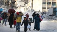 Residents escape Assad regime bombardment in Al Moyaser neighbourhood of Aleppo, Syria on November 29, 2016. ( Jawad al Rifai - Anadolu Agency )