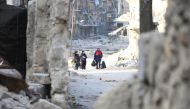 Residents escape Assad regime bombardment in Al Moyaser neighbourhood of Aleppo, Syria on November 29, 2016. ( Jawad al Rifai - Anadolu Agency )
