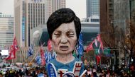 Members of Korean Confederation of Trade Unions march with an effigy of South Korean President Park Geun-hye during a general strike calling for Park to step down, in central Seoul, South Korea November 30, 2016. REUTERS/Kim Hong-Ji
