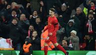 Liverpool's Welsh striker Ben Woodburn celebrates scoring his team's second goal during the English League Cup quarter-final football match between Liverpool and Leeds United at Anfield in Liverpool, north west England on November 29, 2016. Liverpool won 