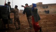 An Iraqi woman reacts as she rushes to a field hospital to see her daughters who were wounded during clashes in the Islamic State stronghold of Mosul, in al-Samah neighborhood, Iraq December 1, 2016. REUTERS/Mohammed Salem
