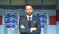 England's new manager Gareth Southgate poses for photographers during a media session after signing a four-year contract with the FA at Wembley Stadium in London, England yesterday.