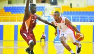 El Jaish's Badron Alione jumps to score a basketball against Al Arabi during their Basketball League match at Al Gharafa Stadium yesterday. RPics by: Baher Amin