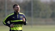 Arsenal's German defender Per Mertesacker runs during a training session at the club's complex in London Colney on December 5, 2016. AFP / ADRIAN DENNIS