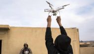 A drone operator from the Mosul Brigade of the Iraqi Special Operations Force 2 (ISOF 2) releases a drone to the air during a military operation to retake parts of the al-Tamim area of Mosul from jihadists of the Islamic State (IS) group on November 5, 20
